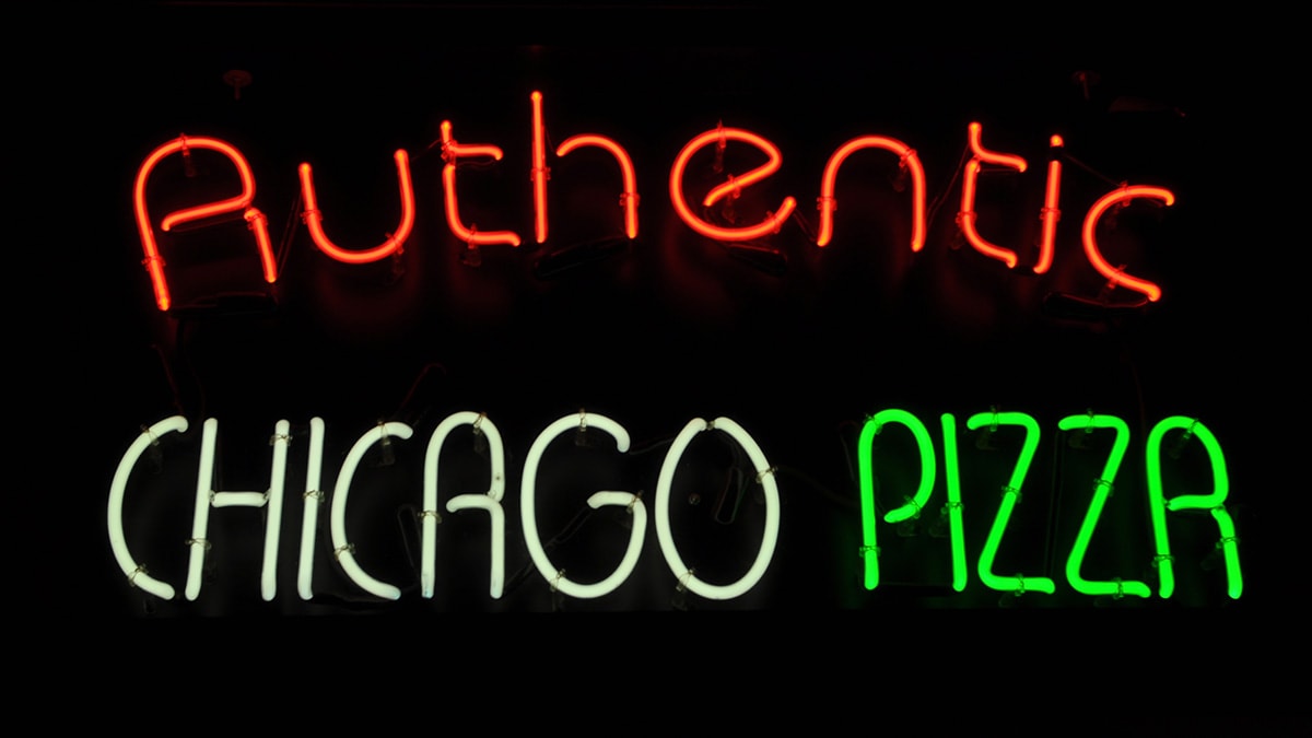 Neon sign advertising Authentic Chicago Pizza